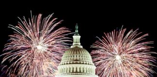 United States Capitol with fireworks at night