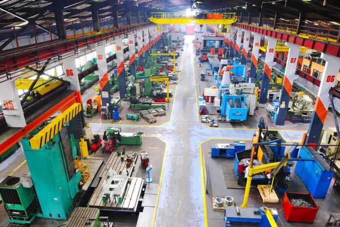 shutterstock_75131428 Aerial view of a large industrial workshop filled with various machinery and equipment