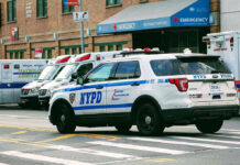 Serial Attacks Minutes Apart Rattle Brooklyn Police car and ambulances outside emergency room entrance.