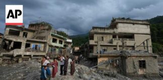 AP reporter shows the aftermath of the deadly flash floods in Nepal