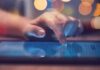 A Swing-District Democrat Has Some Explaining To Do Hand tapping a tablet screen