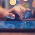 A Swing-District Democrat Has Some Explaining To Do Hand tapping a tablet screen