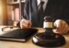 Jury Nails Tourist-Targeting Racket Judge with gavel striking sound block