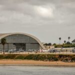 Is America’s Gulf Influence Starting To Fade? airport hangar with helicopters near a shoreline