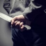 Pedophile Claim, Five-Year Shock Sentence person holding a large knife behind their back