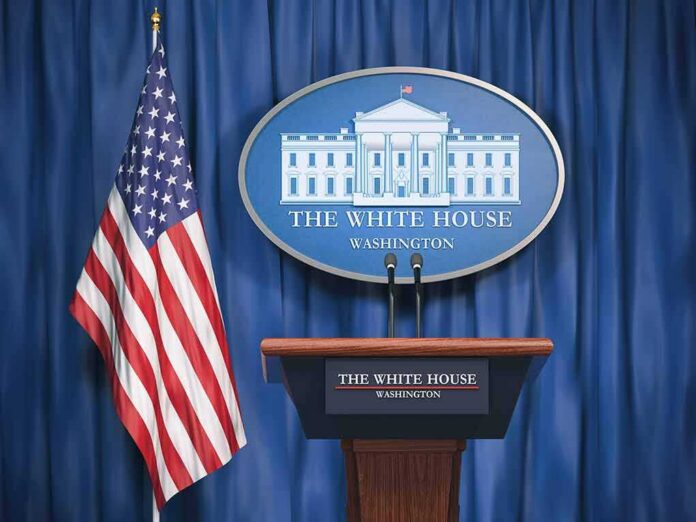 shutterstock_1175844628-1 White House press briefing podium and US flag