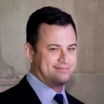 Kimmel Laughs, Lobbyists Move In A smiling man in a suit with a confident expression against a neutral background