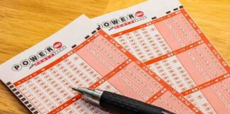Powerball lottery play slips with a black pen