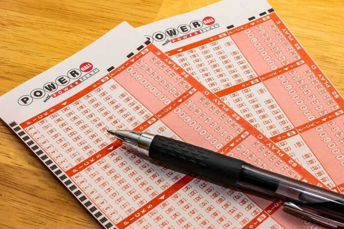 shutterstock_1263329296-1 Powerball lottery play slips with a black pen