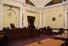 Trump’s Citizenship Fight Just Got a Sequel empty courtroom with judge's bench and columns