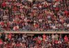 Peter Keys in a large stadium crowd of football fans