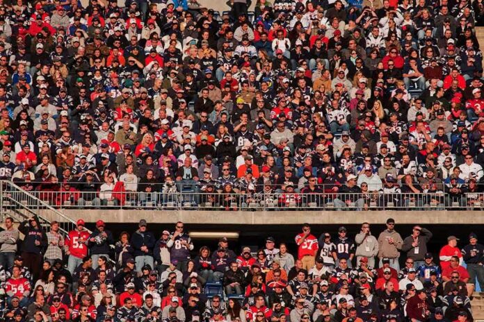 Peter Keys in a large stadium crowd of football fans