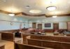 Nearly 30 Years Later, Tupac Gets A Verdict Empty courtroom with wooden benches and judge's bench