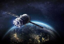 New Satellites Track Yields, Squeeze Markets Satellite orbiting Earth over night side