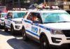 NYPD police SUVs parked in a row on a city street