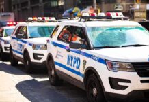Park Avenue Manhole Mystery Halts Motorcades NYPD police SUVs parked in a row on a city street