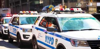 NYPD police SUVs parked in a row on a city street