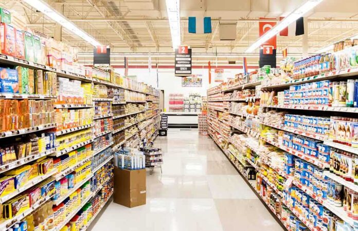 A grocery store aisle filled with various food products on shelves