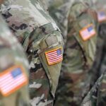 A New American Base Is Getting Much Closer U.S. flag patches on camouflage military uniforms