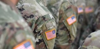 U.S. flag patches on camouflage military uniforms