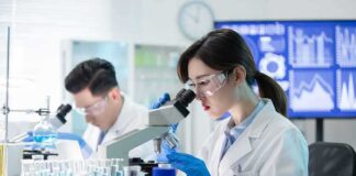 Scientist using a microscope in a modern laboratory