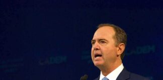 Man in suit speaking at a podium