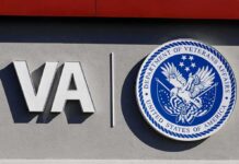 Fake War Hero Drains VA Funds VA logo and Department of Veterans Affairs seal on building wall