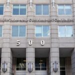 Mexico Escalates Fight After Fatal ICE Encounter US government building facade with flags and number 500