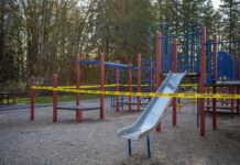 Playground equipment wrapped with caution tape