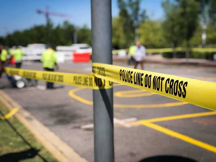 Police tape cordons off a street scene