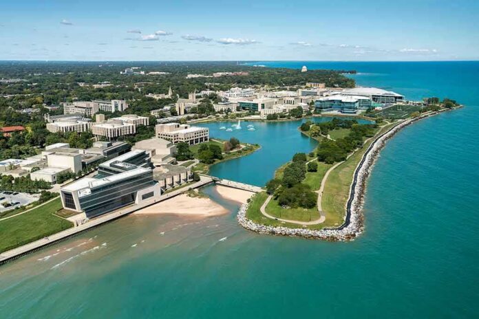 aerial view of a lakeside university campus with lagoon and curved shoreline