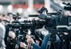 Election Rules? One Check Blows Them Up Broadcast cameras on tripods at a press event