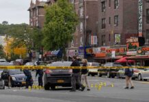 One Shooting, Two Stories, and Missing Footage Police investigate a taped-off urban street crime scene