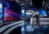 One Republican’s Polling Verdict Stuns CNN Panel modern television news studio with large video screens