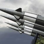 Cost Explosion Stuns America’s Next Nuke Missiles mounted on a launcher against a cloudy sky