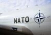 Europe’s American Security Blanket Just Got Smaller Aircraft fuselage with NATO emblem and lettering