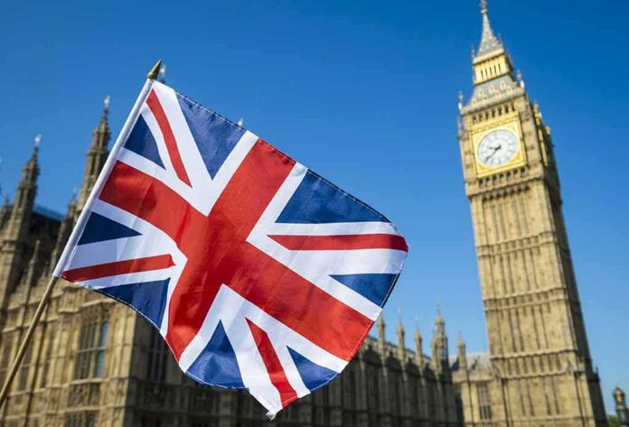 shutterstock_636097766 Union Jack flag with Elizabeth Tower in the background