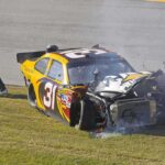 NASCAR Legend Gone — Mystery Illness Claims Kyle Busch Race car with heavy front-end damage on grass