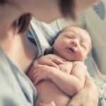 Baby’s Care Decided – Not By The Birth Mom newborn baby sleeping in a parent's arms