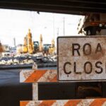 Seoul’s Demolition Turned DEADLY Chaos Road closed sign at construction site under overpass