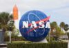 The Next 5G Coverage Zone Isn’t on Earth NASA globe sign at visitor center with space shuttle booster in background