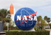 The Next 5G Coverage Zone Isn’t on Earth NASA globe sign at visitor center with space shuttle booster in background