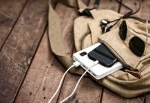 Cross-Country Glory, Bay Area Bust Beige backpack with phone charging on power bank and sunglasses