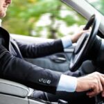 The Interview Ended. Then Things Got Dangerous Driver in a suit operating a car