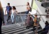 VA Schools Brace After Chilling Messages Students walking on a school staircase