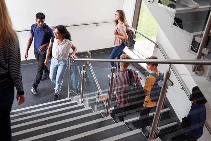 Students walking on a school staircase