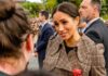A Sworn Complaint Triggers A Cross-Border Investigation Meghan, Duchess of Sussex greets a person in a crowd outdoors