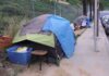 Tent encampment along a city sidewalk