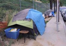 Tent encampment along a city sidewalk
