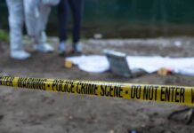 Desert Graves Horror Baffles LA Detectives Police crime scene with yellow tape and forensic team